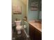 Charming powder room featuring a decorative mirror, a single vanity, and a toilet with stylish wall decor at 13124 S Elster Way, Fishers, IN 46037