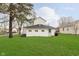 Expansive backyard with a lush lawn, showcasing the home's rear exterior and ample green space at 1407 Hannibal St, Noblesville, IN 46060