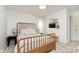 Charming bedroom with a unique wooden bed frame, complemented by tasteful decor and soft, natural light at 1407 Hannibal St, Noblesville, IN 46060