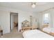 Bright bedroom featuring twin beds, built-in shelving, and a sunlit window for a cozy and inviting space at 1407 Hannibal St, Noblesville, IN 46060