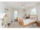 Comfortable bedroom with two wooden twin beds, accented by soft lighting and charming decor for a peaceful retreat at 1407 Hannibal St, Noblesville, IN 46060
