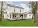 Charming two-story home featuring a covered porch with swing and well-maintained lawn at 1407 Hannibal St, Noblesville, IN 46060
