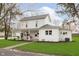 Charming two-story home featuring a covered porch with swing and well-maintained lawn at 1407 Hannibal St, Noblesville, IN 46060