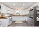 Modern kitchen with stainless steel appliances, white cabinets, and butcher block countertops at 1407 Hannibal St, Noblesville, IN 46060