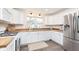 Modern kitchen features stainless steel appliances, white cabinets, butcher block countertops, and a view of the neighborhood at 1407 Hannibal St, Noblesville, IN 46060
