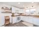Bright kitchen featuring white cabinets, butcher block countertops, and modern appliances for a cozy culinary experience at 1407 Hannibal St, Noblesville, IN 46060