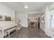 Bright living room featuring hardwood floors, a staircase and a white piano at 1407 Hannibal St, Noblesville, IN 46060