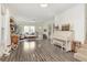 Open-concept living room with hardwood floors, neutral décor, and ample natural light at 1407 Hannibal St, Noblesville, IN 46060