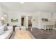 Spacious living room with hardwood floors, neutral décor, and views into adjoining rooms at 1407 Hannibal St, Noblesville, IN 46060