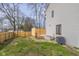 A backyard features a newly constructed wooden fence and small deck area at 1512 Tipton Ln, Columbus, IN 47201