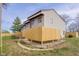 An enclosed back porch with a wood fence offers backyard privacy at 1512 Tipton Ln, Columbus, IN 47201