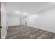 Finished basement featuring vinyl floors, neutral paint and a modern decorative fireplace at 1512 Tipton Ln, Columbus, IN 47201