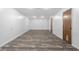 Spacious basement with laminate flooring offering potential for customization and ample storage at 1512 Tipton Ln, Columbus, IN 47201