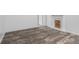 Finished basement area with wood-look laminate flooring and modern decorative fireplace at 1512 Tipton Ln, Columbus, IN 47201