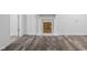 Basement area with wood-look laminate flooring and modern decorative fireplace at 1512 Tipton Ln, Columbus, IN 47201