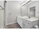 Stylish bathroom with double vanity, modern fixtures, ample counter space, and wood-look flooring at 1512 Tipton Ln, Columbus, IN 47201
