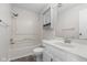 Bathroom featuring a vanity, toilet, bathtub, shower, and linen storage at 1512 Tipton Ln, Columbus, IN 47201