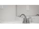 Close-up of a bathroom sink featuring a chrome faucet and a white countertop with sleek, modern design elements at 1512 Tipton Ln, Columbus, IN 47201