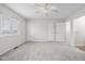 Large bedroom with carpet, a ceiling fan, and natural light creates a bright and inviting atmosphere at 1512 Tipton Ln, Columbus, IN 47201
