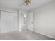 Bedroom with carpet, closet, and a door that opens into another room at 1512 Tipton Ln, Columbus, IN 47201