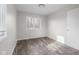 Bedroom featuring light wood-look flooring and lots of natural light at 1512 Tipton Ln, Columbus, IN 47201