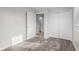 Bedroom featuring a closet, light wood-look flooring, and white trim at 1512 Tipton Ln, Columbus, IN 47201