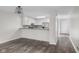 Living room featuring eat-in kitchen with updated appliances and a view into the entry way at 1512 Tipton Ln, Columbus, IN 47201