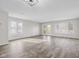 Bright and spacious living room with luxury floors, large windows, and a glass paneled patio door at 1512 Tipton Ln, Columbus, IN 47201
