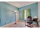 Bright bedroom with a calming blue accent wall and a functional workspace at 15433 Wandering Way, Noblesville, IN 46060