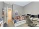 Teen bedroom with grey walls and small desk at 15433 Wandering Way, Noblesville, IN 46060