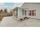 Exterior view of a sunroom addition and an outdoor patio, perfect for entertaining at 15433 Wandering Way, Noblesville, IN 46060
