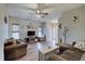 Spacious living room with ceiling fan, wood flooring and neutral paint at 15433 Wandering Way, Noblesville, IN 46060