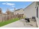 Back patio with ample seating, a cozy fire pit, and privacy fencing at 15433 Wandering Way, Noblesville, IN 46060
