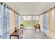 Bright sunroom with large windows, comfortable seating, and ample natural light at 15433 Wandering Way, Noblesville, IN 46060