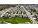 Drone shot showcases a community with well-placed homes and manicured lawns at 15679 Woodford Dr, Westfield, IN 46074