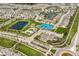 Aerial of planned community with ponds, sports courts, pool, clubhouse and suburban homes at 15679 Woodford Dr, Westfield, IN 46074