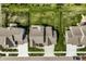 Top-down aerial view of houses with landscaped yards, showcasing symmetrical driveways and lush greenery at 15679 Woodford Dr, Westfield, IN 46074
