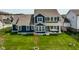 Expansive backyard featuring a well-manicured lawn and patio perfect for outdoor living at 15679 Woodford Dr, Westfield, IN 46074