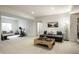 Bright basement area featuring a home gym, seating, and a table for activities, perfect for recreation and relaxation at 15679 Woodford Dr, Westfield, IN 46074