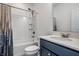 Bathroom with a tub and shower combo, and a blue vanity at 15679 Woodford Dr, Westfield, IN 46074
