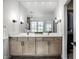 Bright bathroom with double vanity, modern fixtures, and a large mirror reflecting the windows at 15679 Woodford Dr, Westfield, IN 46074