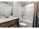 Bright bathroom with a modern vanity, white tub/shower combo, and neutral decor, creating a clean and functional space at 15679 Woodford Dr, Westfield, IN 46074