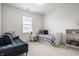 Bedroom with blue sofa and single bed at 15679 Woodford Dr, Westfield, IN 46074
