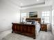 Primary bedroom suite featuring tray ceilings and two bedside tables at 15679 Woodford Dr, Westfield, IN 46074