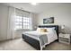 Bright bedroom featuring a comfortable bed, side tables, and curtains at 15679 Woodford Dr, Westfield, IN 46074