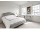 Bright bedroom featuring a cozy bed, a modern desk, and scenic view at 15679 Woodford Dr, Westfield, IN 46074
