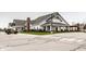 Exterior view of community clubhouse with ample parking and a welcoming entrance at 15679 Woodford Dr, Westfield, IN 46074