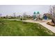 Outdoor play area features playground, basketball court, and grassy play area at 15679 Woodford Dr, Westfield, IN 46074