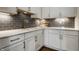 Elegant kitchen with white cabinets, subway tile backsplash, and marble counter tops at 15679 Woodford Dr, Westfield, IN 46074