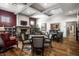 Comfortable living area featuring wood floors, a fireplace, and ample seating at 15679 Woodford Dr, Westfield, IN 46074